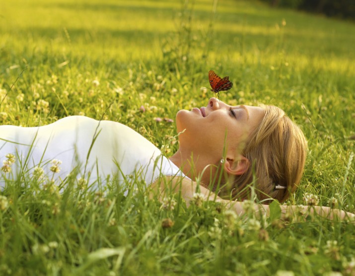 iStock_000016995379Medium-BHR-girl-lying-grass-butterfly