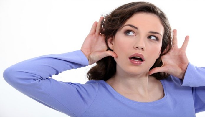 woman listening something carefully