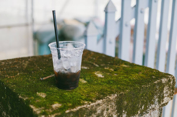 drinking through plastic straws