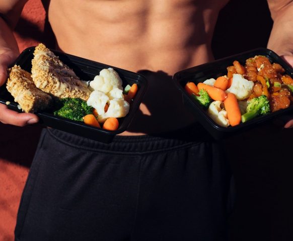 healthy man showing his food