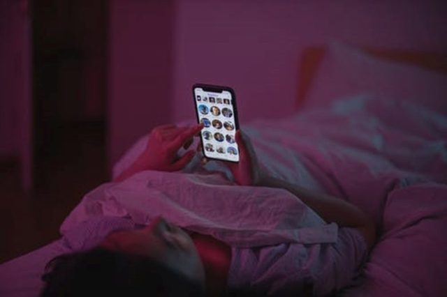 Girl browsing social media apps on mobile phone