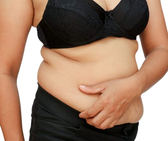 what causes belly fat in females