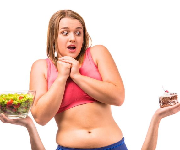 what causes belly fat in females