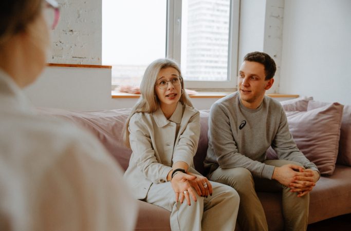 Couple talking with therapist