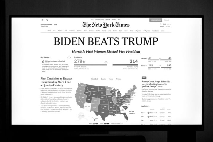 Biden wins presidency over Trump as detailed on newspaper front page.