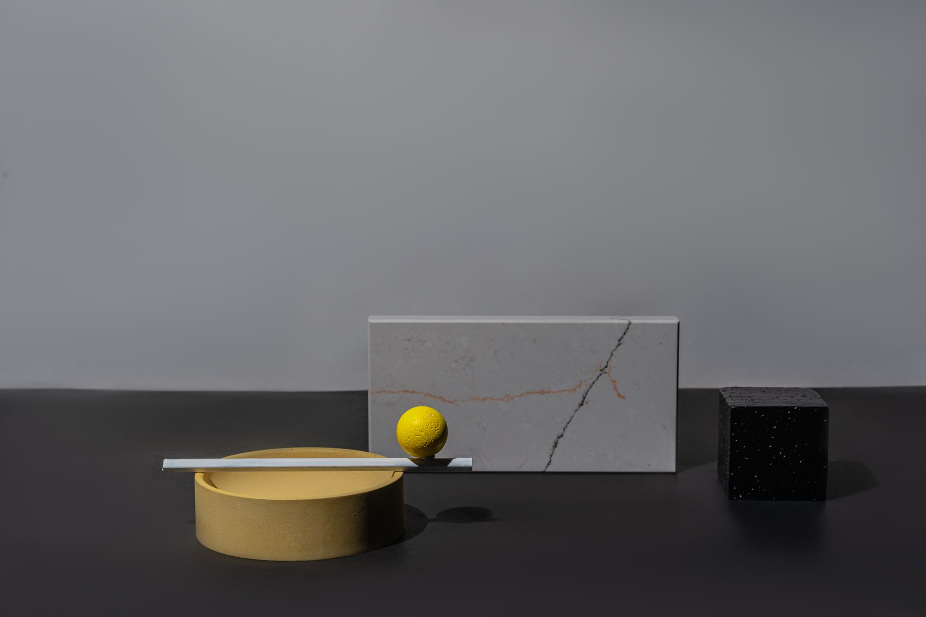 A sleek arrangement of geometric shapes and textures in a minimalist style, emphasizing elegance.